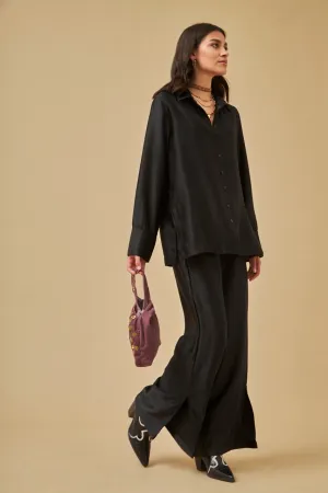 Flowy black satin palazzo trousers by NKN