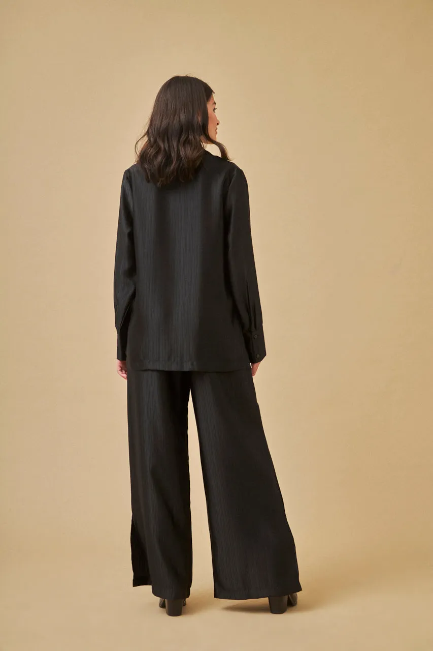 Flowy black satin palazzo trousers by NKN